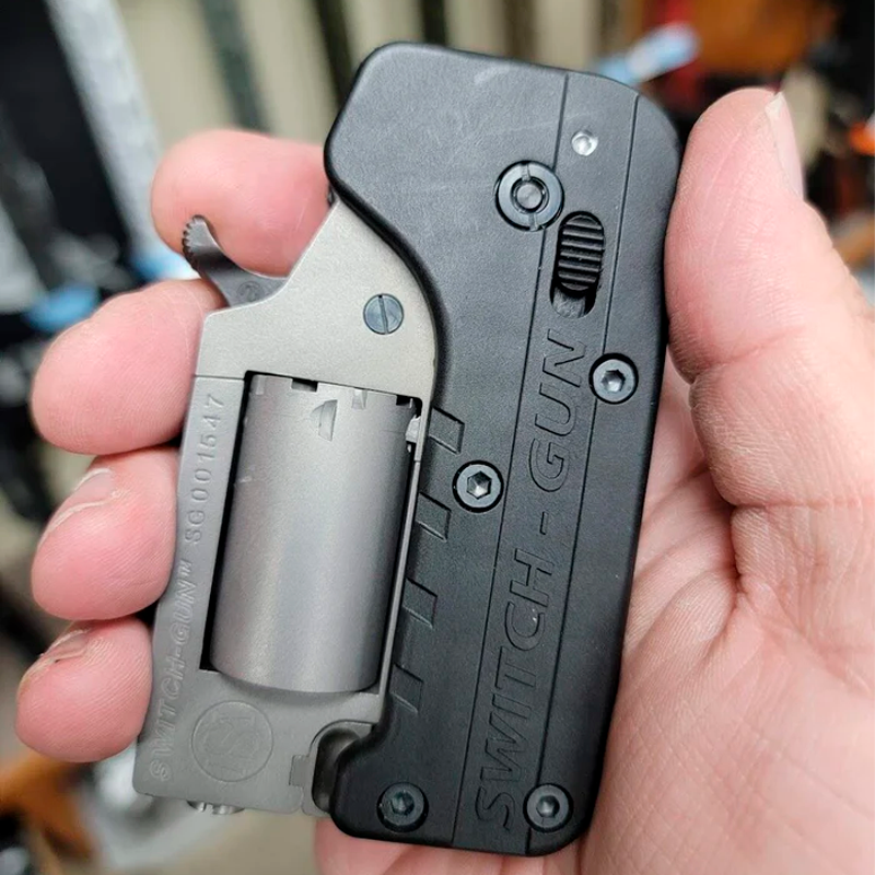 Mini Arma Switch Gun Dobrável Cal. 22
